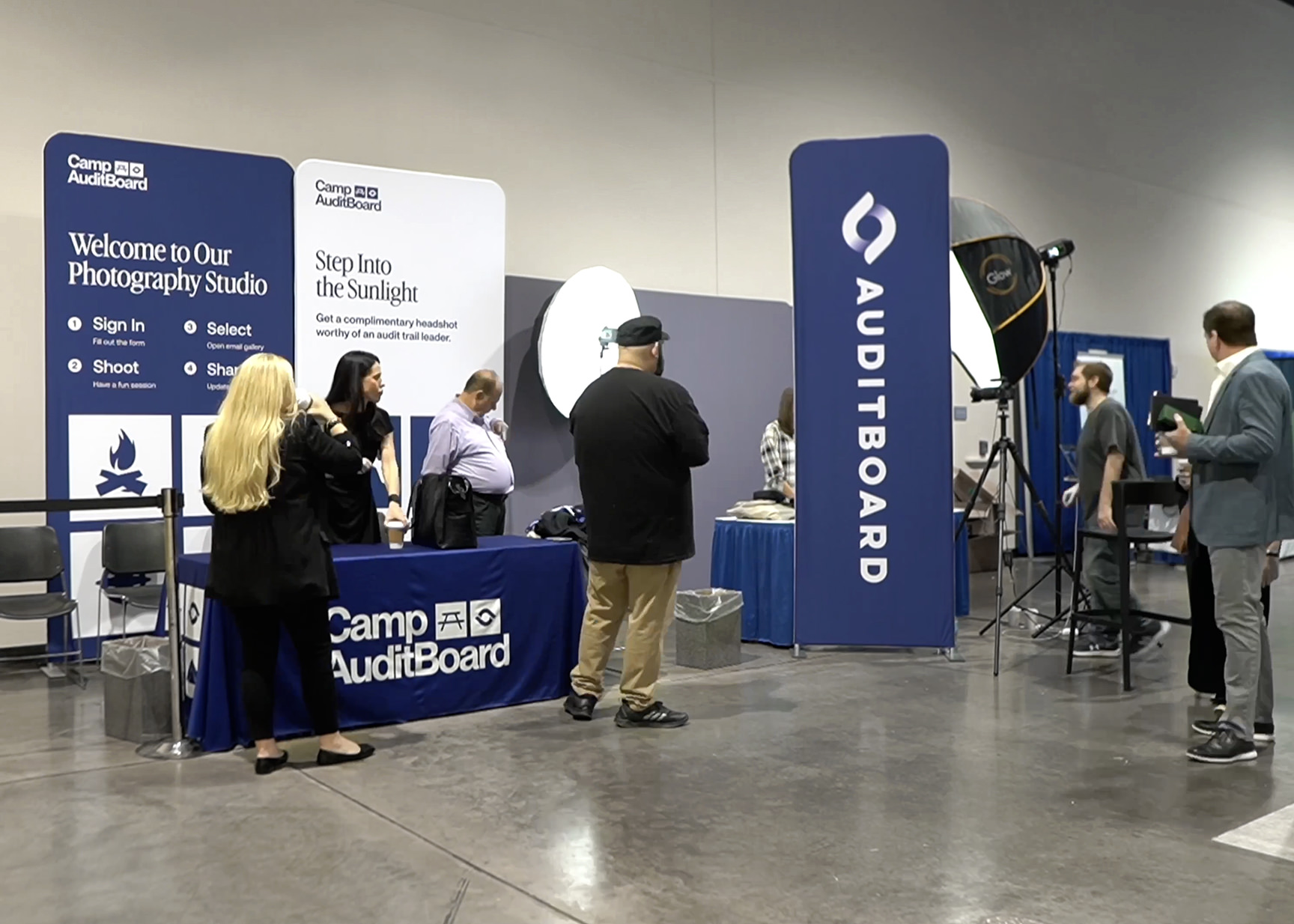 Corporate event headshot booth custom branded backdrop signage professional photography nationwide